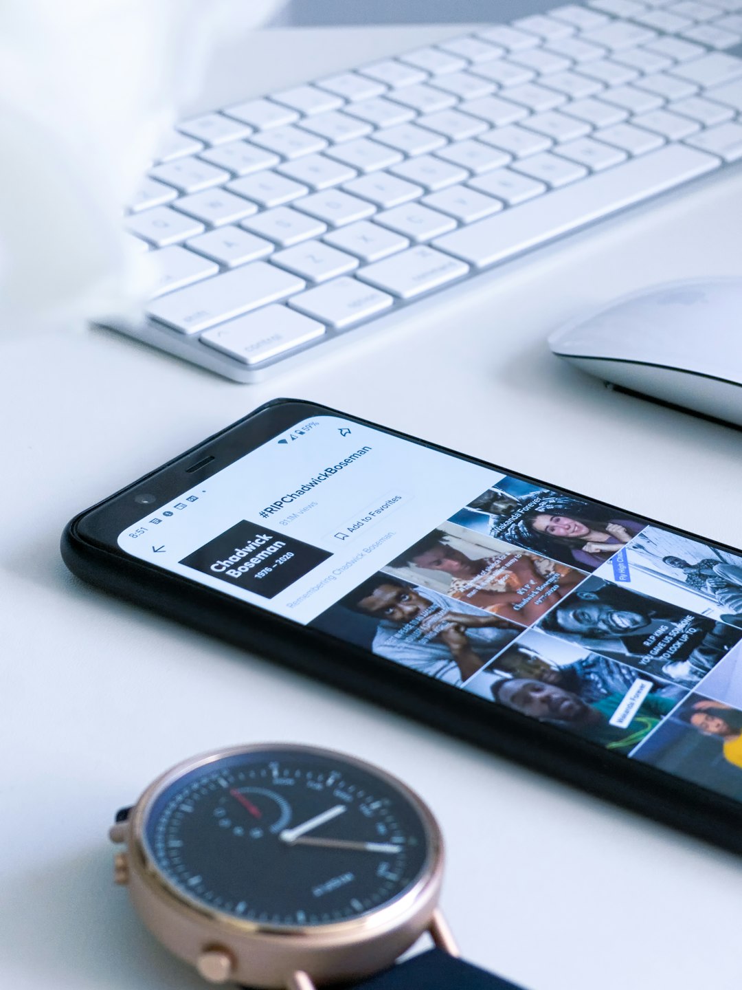 project-02-c A Google Pixel 4 XL, Misfit Smartwatch, Apple Keyboard and Apple Mouse on a white table.
