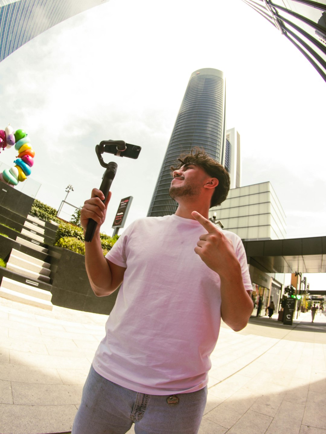 project-02-b man-filming-with-gimbal-and-phone-in-city-htxkn-dv8pe